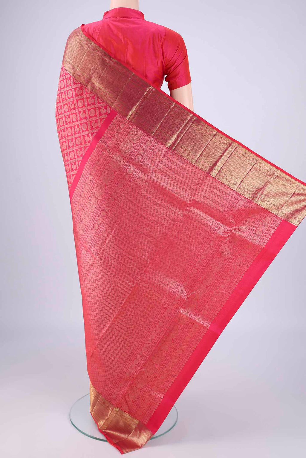 Flat view of Rani Pink Kanchipuram Silk Saree with Zari Brocade on the body and Zari Border. 