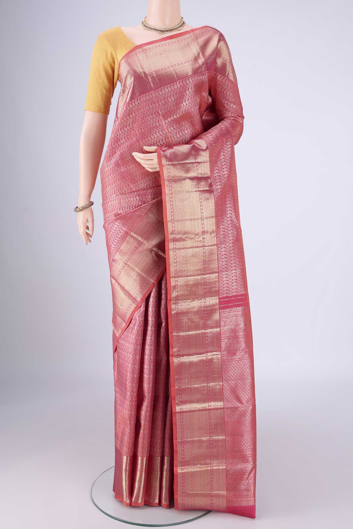 Pink Kanchipuram Silk Saree with Zari Brocade on the body and Zari Border.  displayed on a mannequin