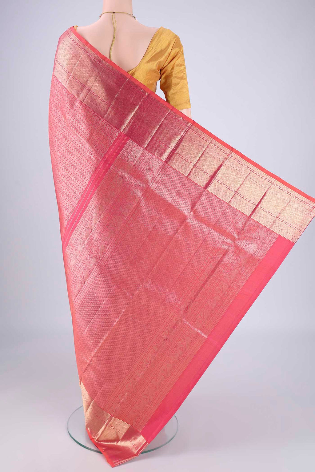 Flat view of Pink Kanchipuram Silk Saree with Zari Brocade on the body and Zari Border. 