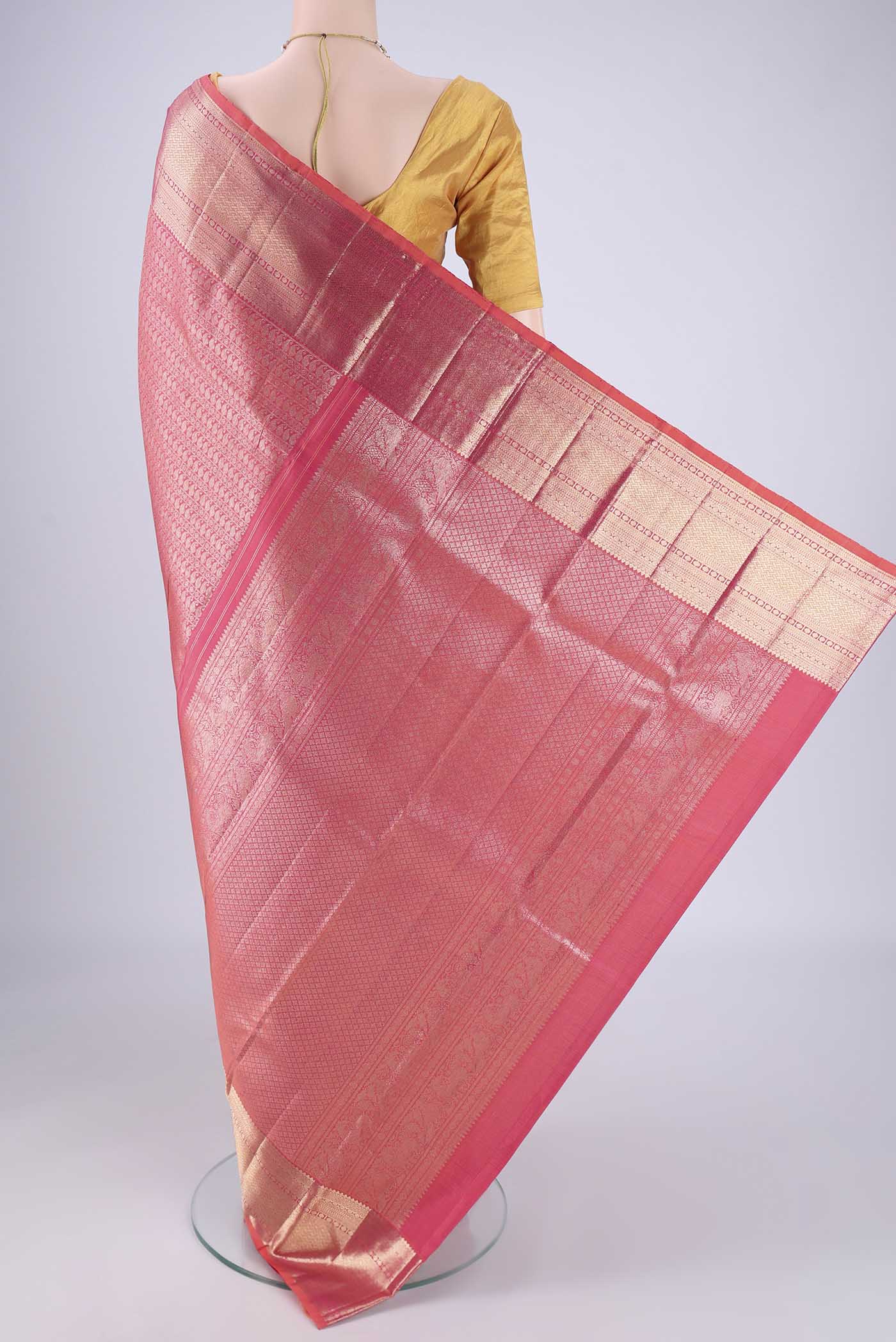 Flat view of Pink Kanchipuram Silk Saree with Zari Brocade on the body and Zari Border. 