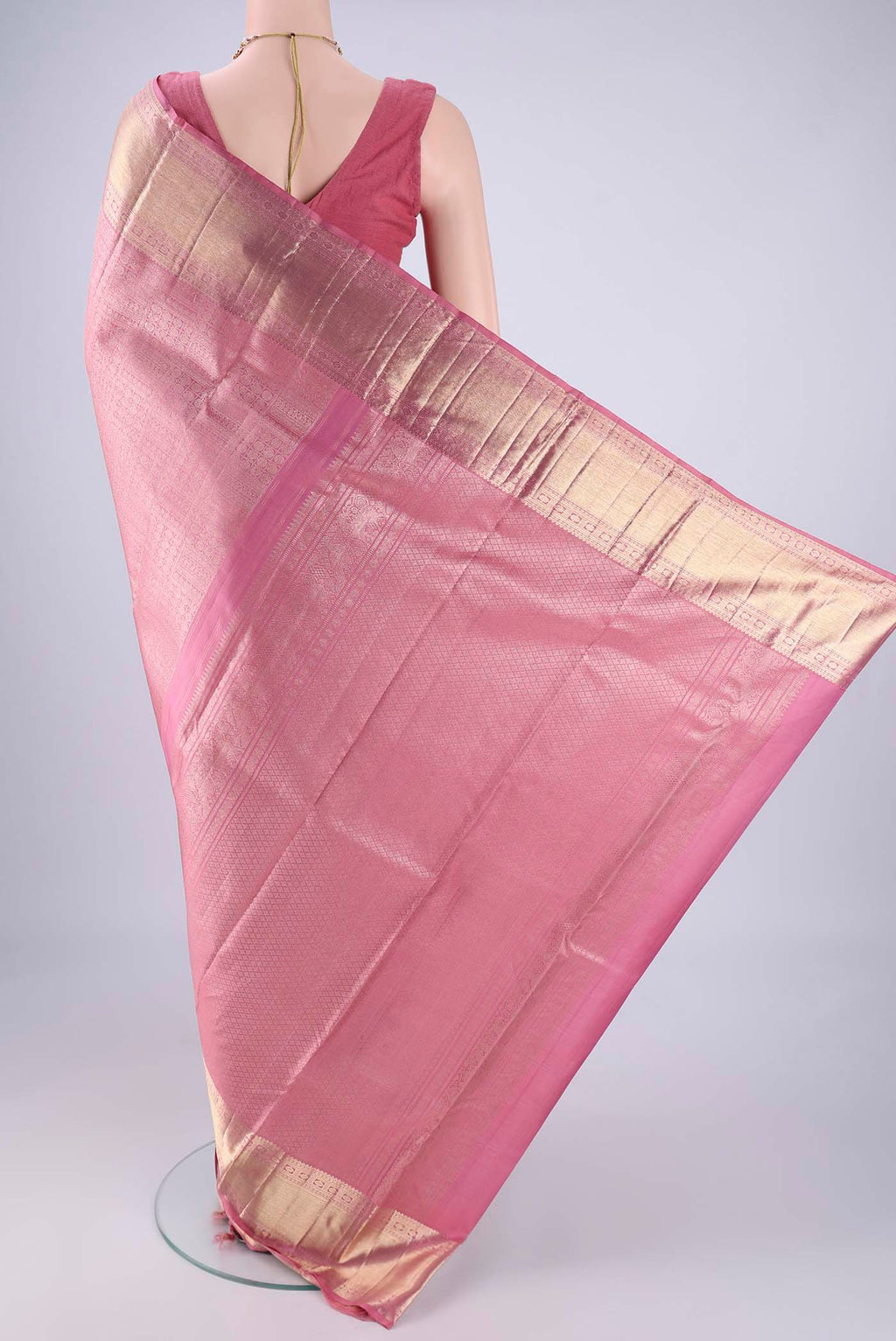 Flat view of Rose pink Kanchipuram Silk Saree with Zari Brocade on the body and Zari Border. 