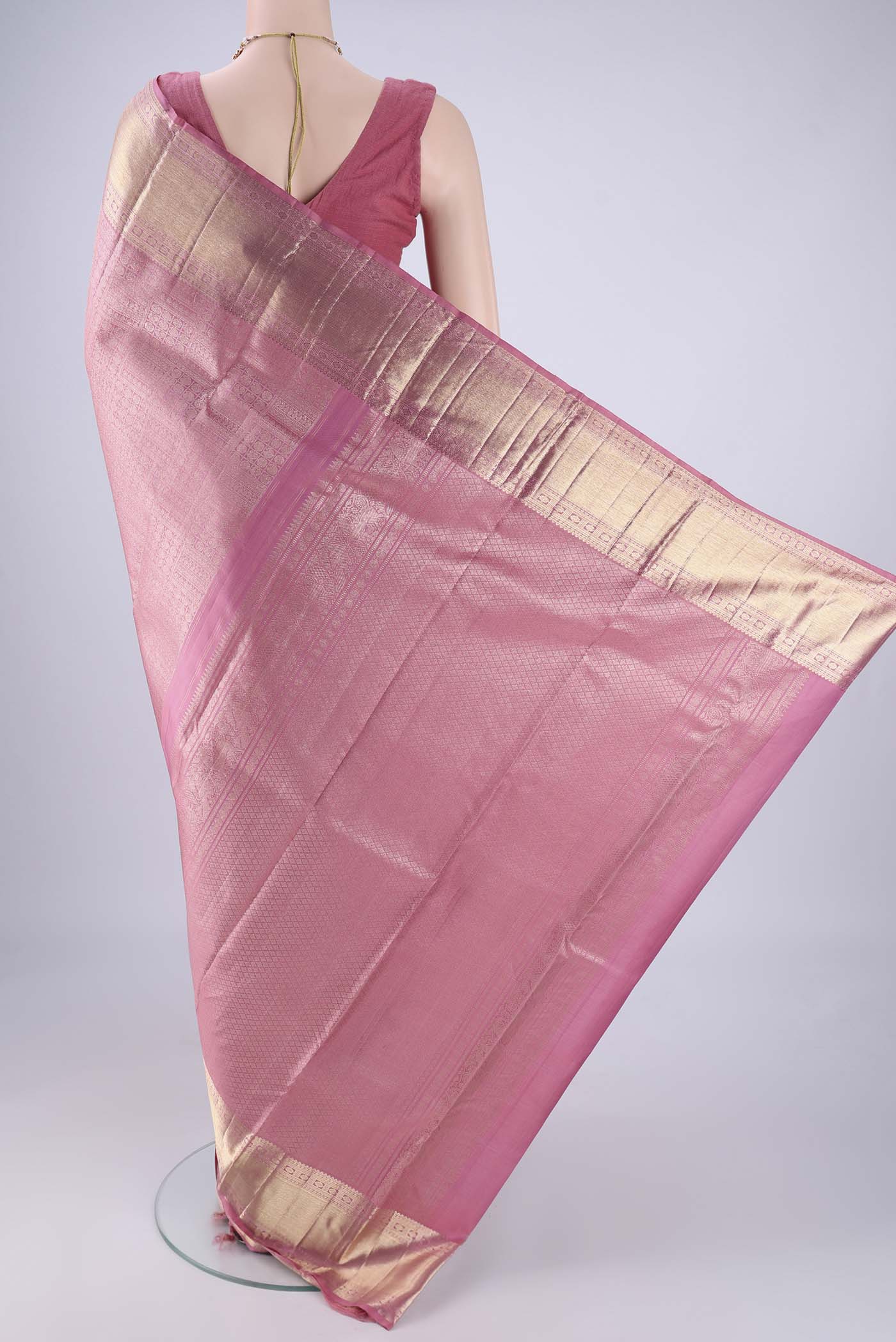 Flat view of Rose pink Kanchipuram Silk Saree with Zari Brocade on the body and Zari Border. 