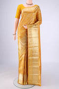 Mustard Kanchipuram Silk Saree with Zari Brocade on the body and Zari Border.  displayed on a mannequin