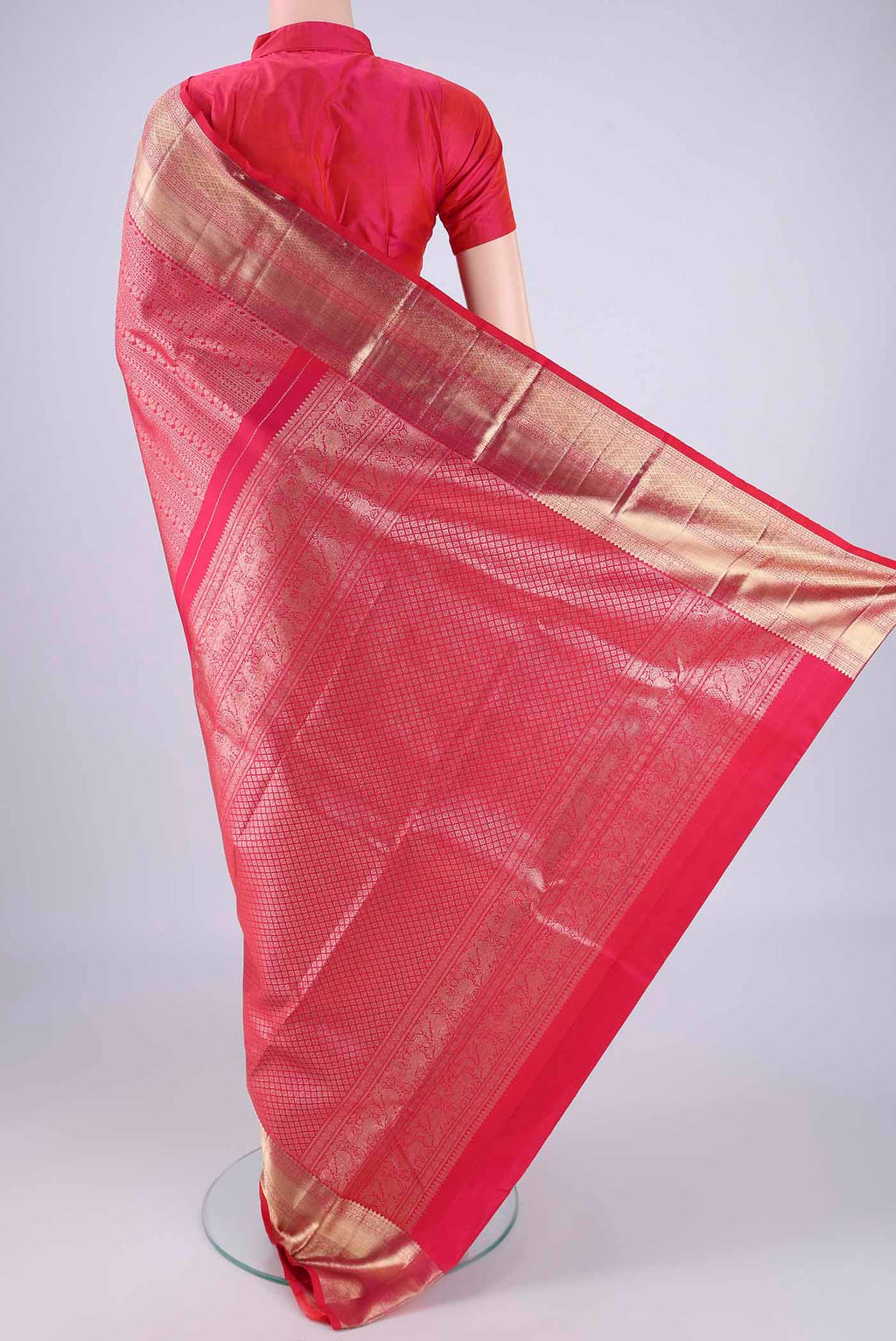 Flat view of Dark Pink Kanchipuram Silk Saree with Zari Brocade on the body and Zari Border. 