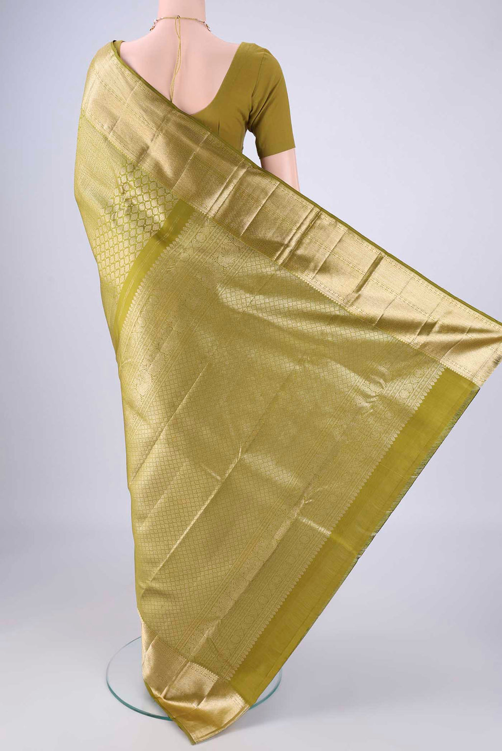 Flat view of Mehandi Green Kanchipuram Silk Saree with Zari Brocade on the body and Zari Border. 