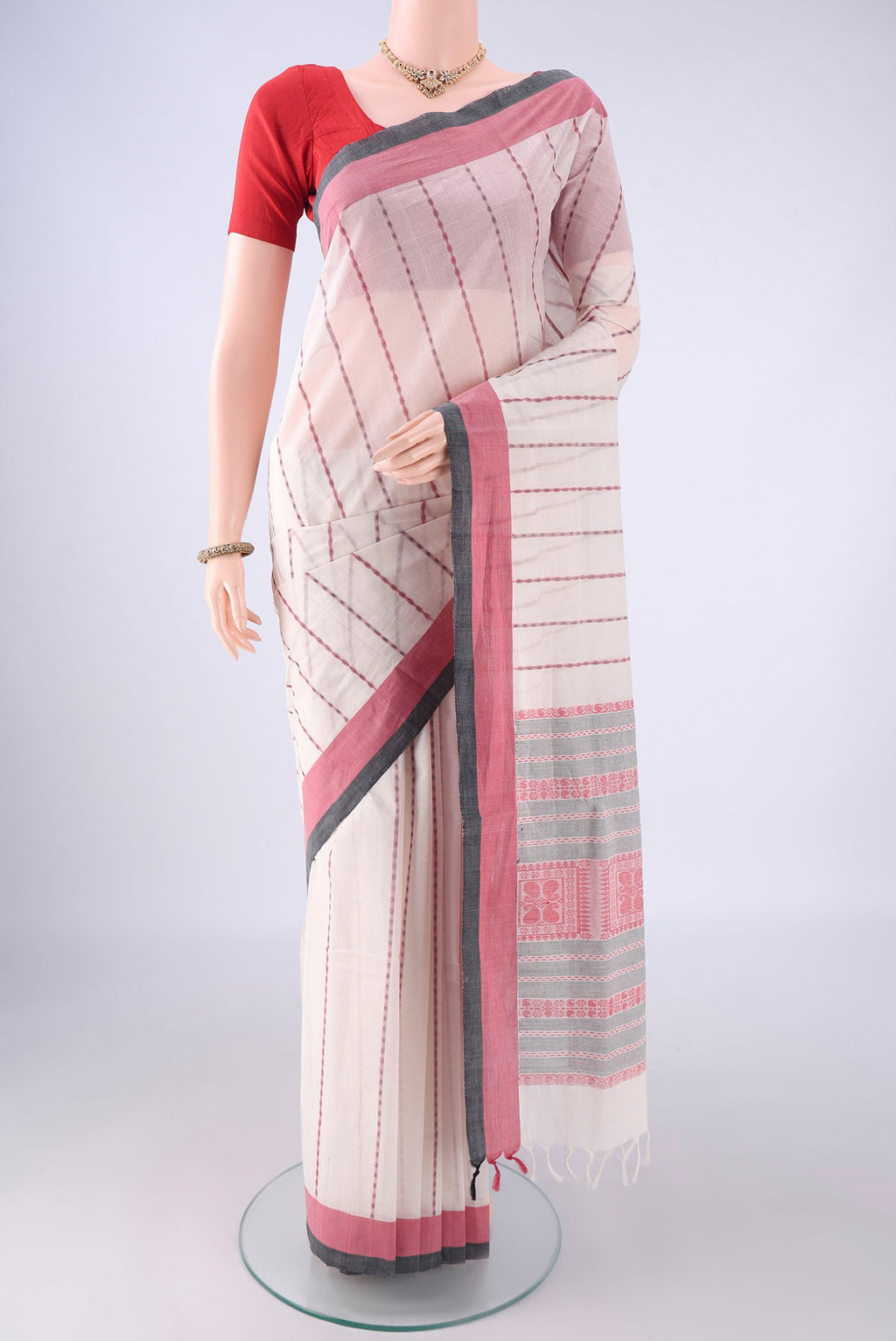 White Coimbatore Cotton Saree with Stripes on the body and Thread Border.  displayed on a mannequin