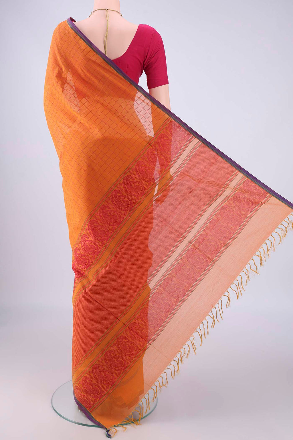 Flat view of Orange Coimbatore Cotton Saree with Checked design on the body and Thread Border. 