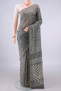 Grey Chanderi Cotton Saree with Batik Print on the body and Thin Zari Line.  displayed on a mannequin