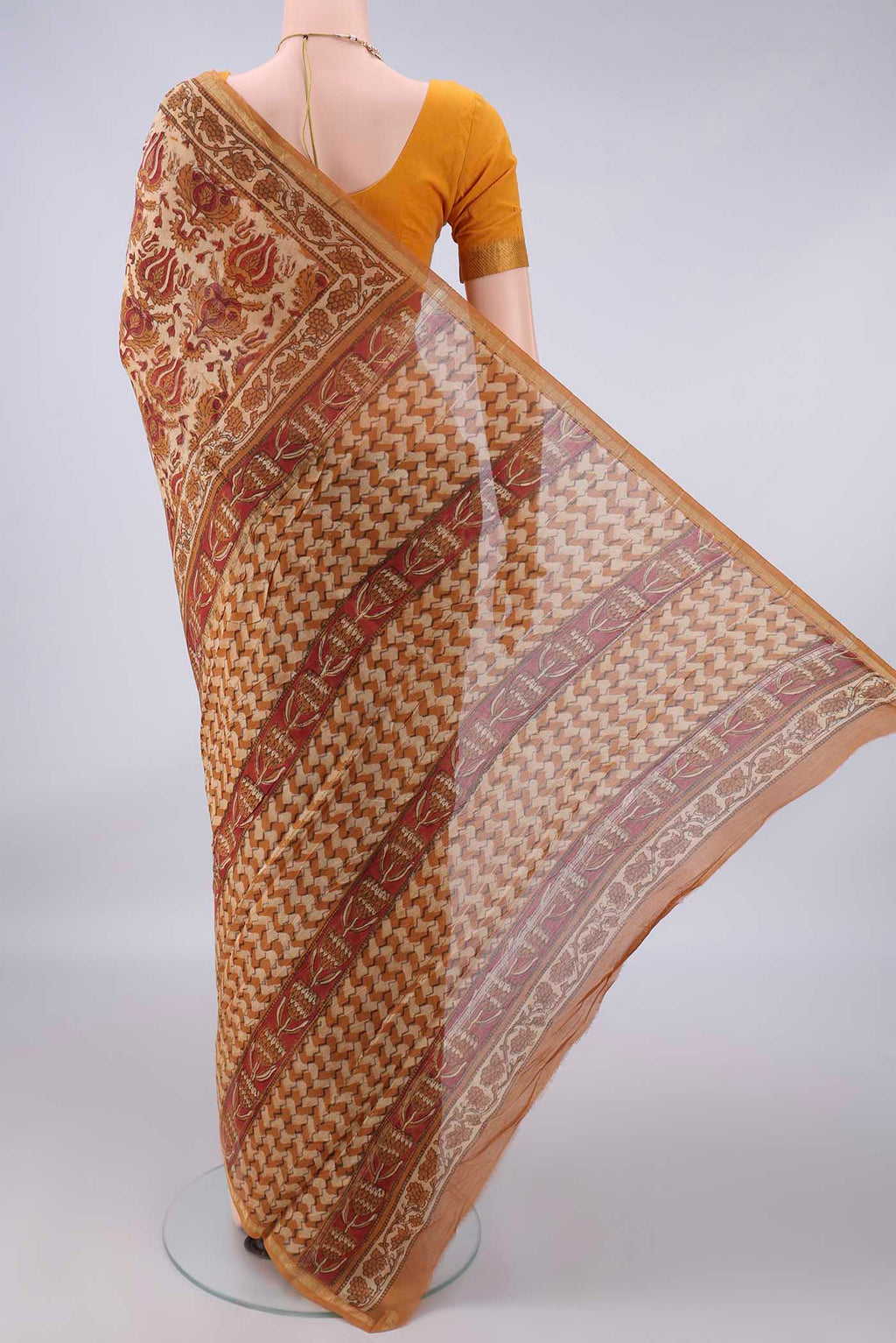 Flat view of Sandal Chanderi Cotton Saree with Batik Print on the body and Thin Zari Line. 