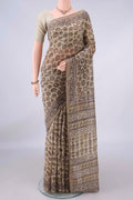 Beige Chanderi Cotton Saree with Batik Print on the body and Thin Zari Line.  displayed on a mannequin