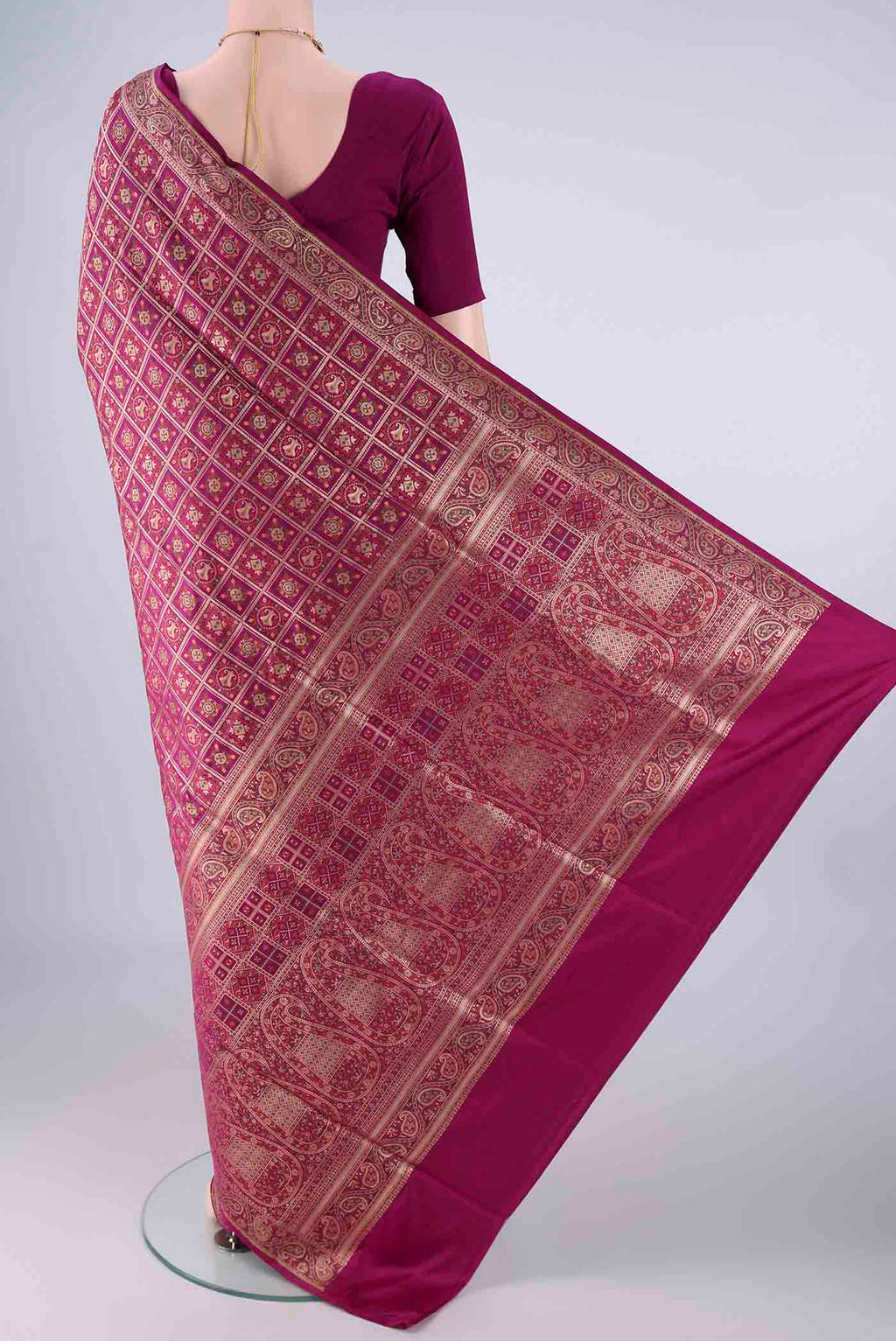 Flat view of Magenta Banarasi Jamavar Saree with Checked design on the body and Zari Border. 