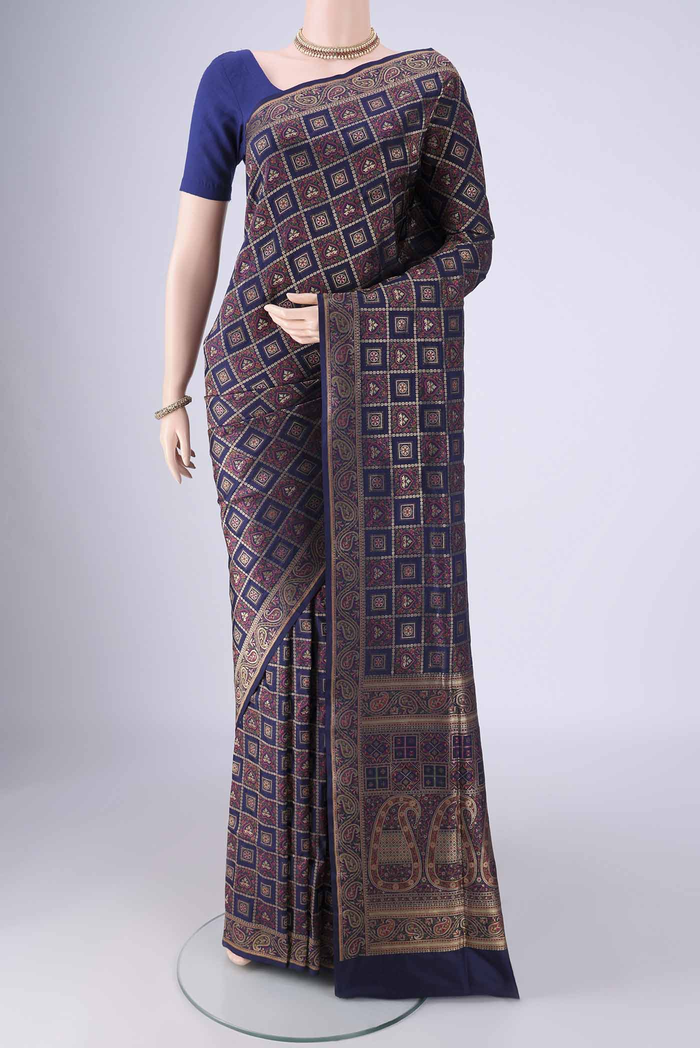 Navy Blue Banarasi Jamavar Saree with Checked design on the body and Zari Border.  displayed on a mannequin