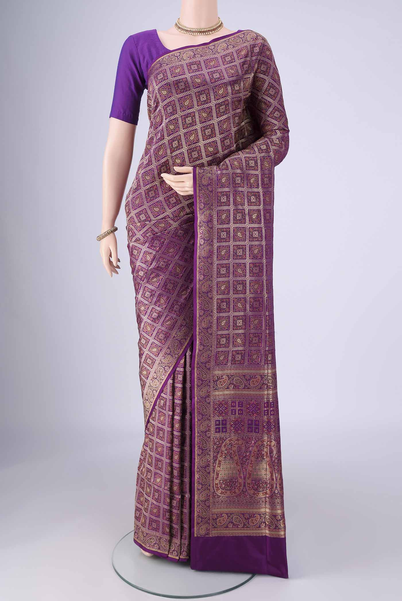 Purple Banarasi Jamavar Saree with Checked design on the body and Zari Border.  displayed on a mannequin