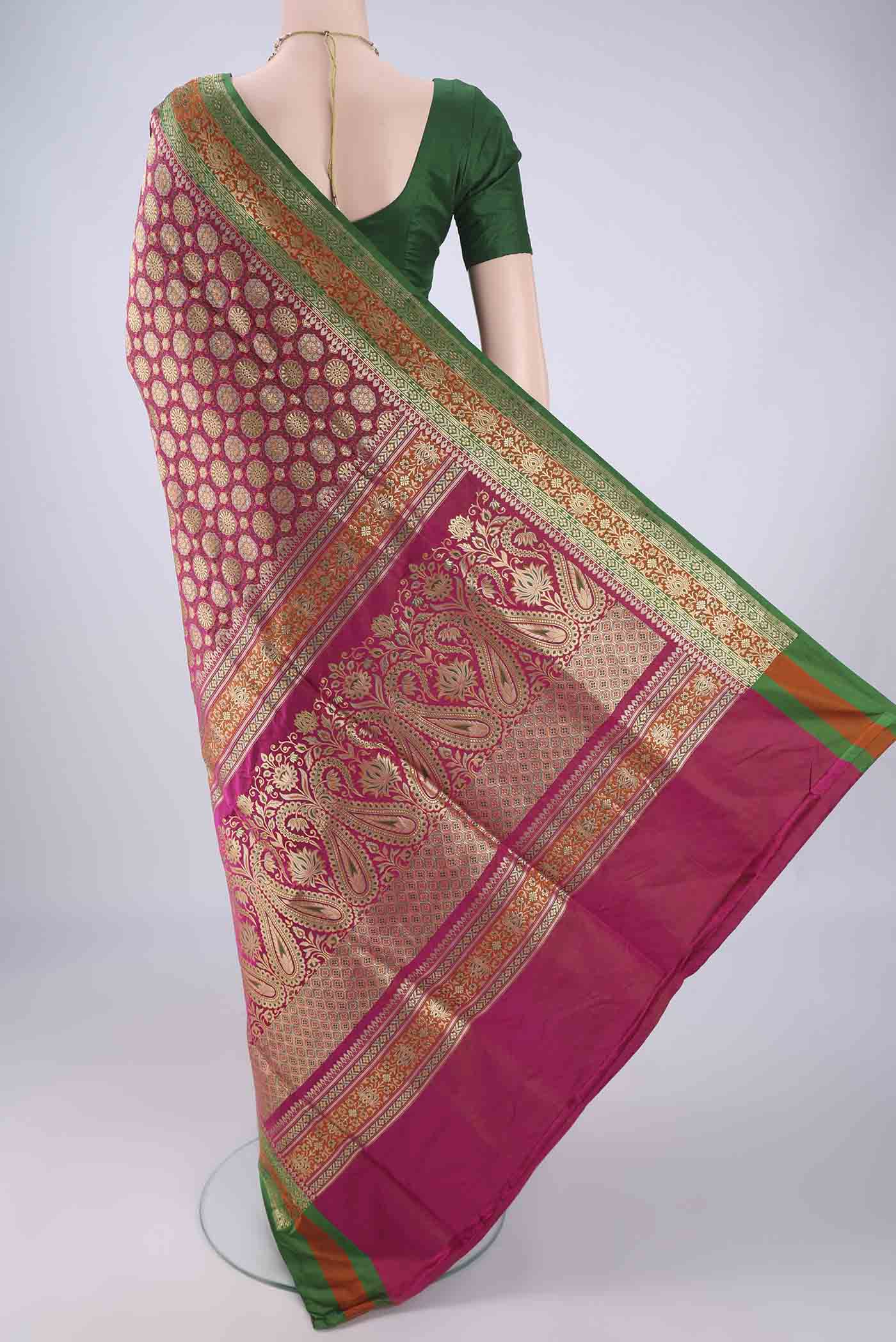 Flat view of Pink Banarasi Silk Saree with Zari Brocade on the body and Zari Border. 