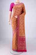 Brick Orange Banarasi Jamavar Saree with Checked design on the body and Zari Border.  displayed on a mannequin