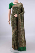Pure Silk Green Banarasi Jamavar Saree with Checked design on the body and Zari Border.  displayed on a mannequin