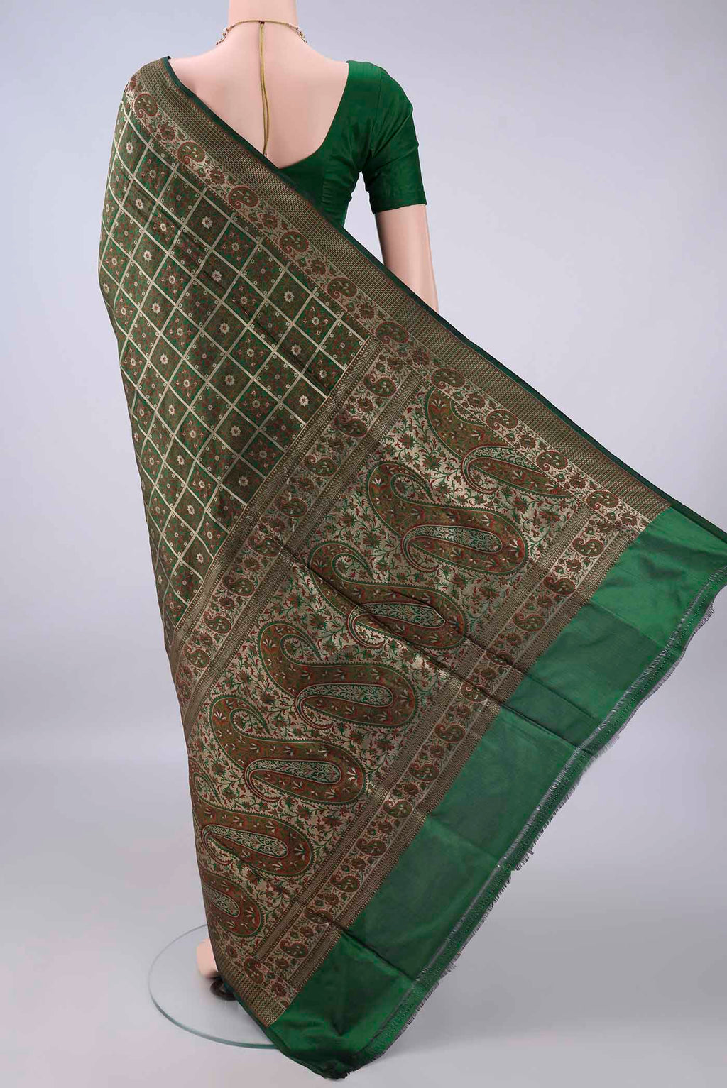 Flat view of Pure Silk Green Banarasi Jamavar Saree with Checked design on the body and Zari Border. 