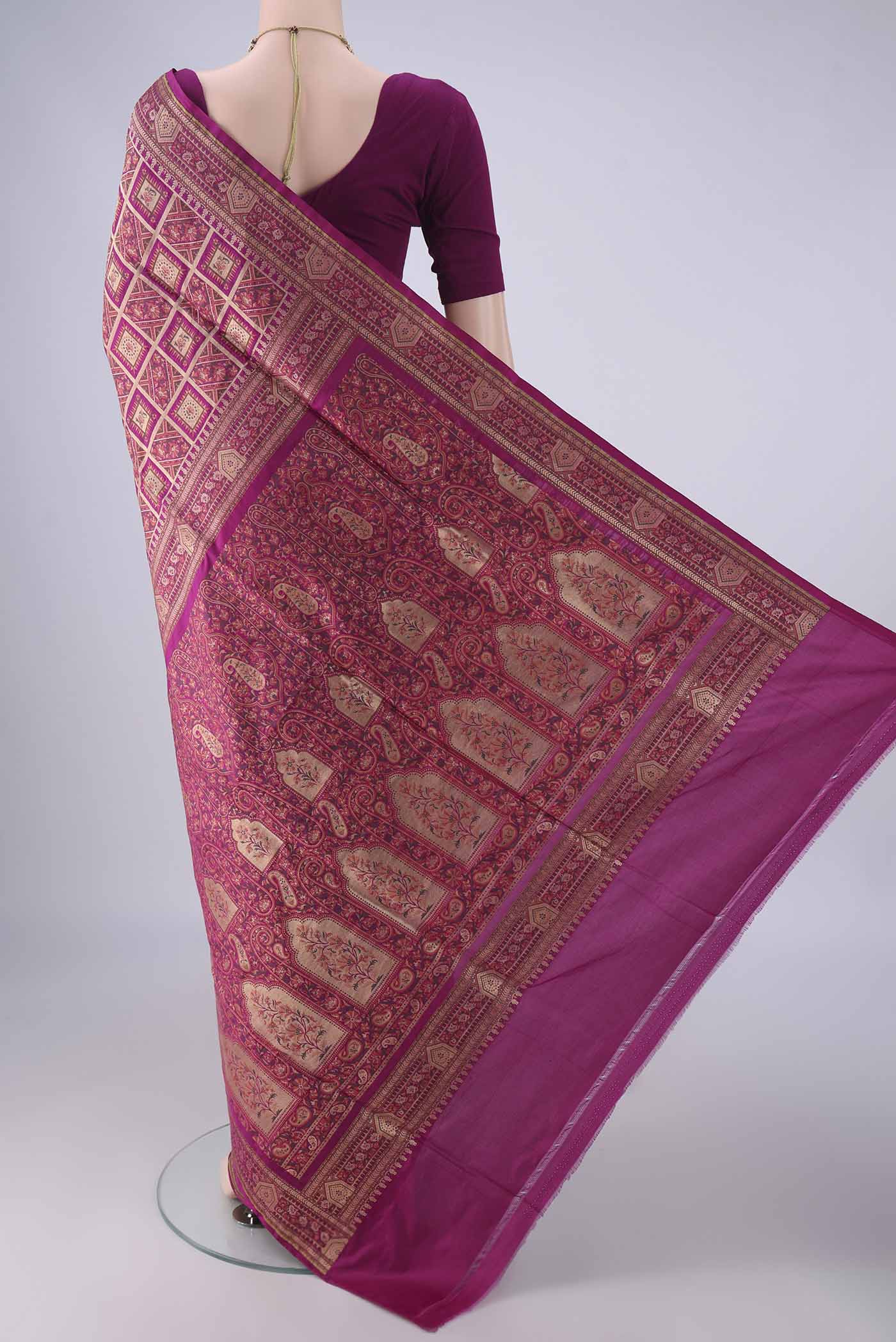 Flat view of Magenta Banarasi Jamavar Saree with Checked design on the body and Zari Border. 