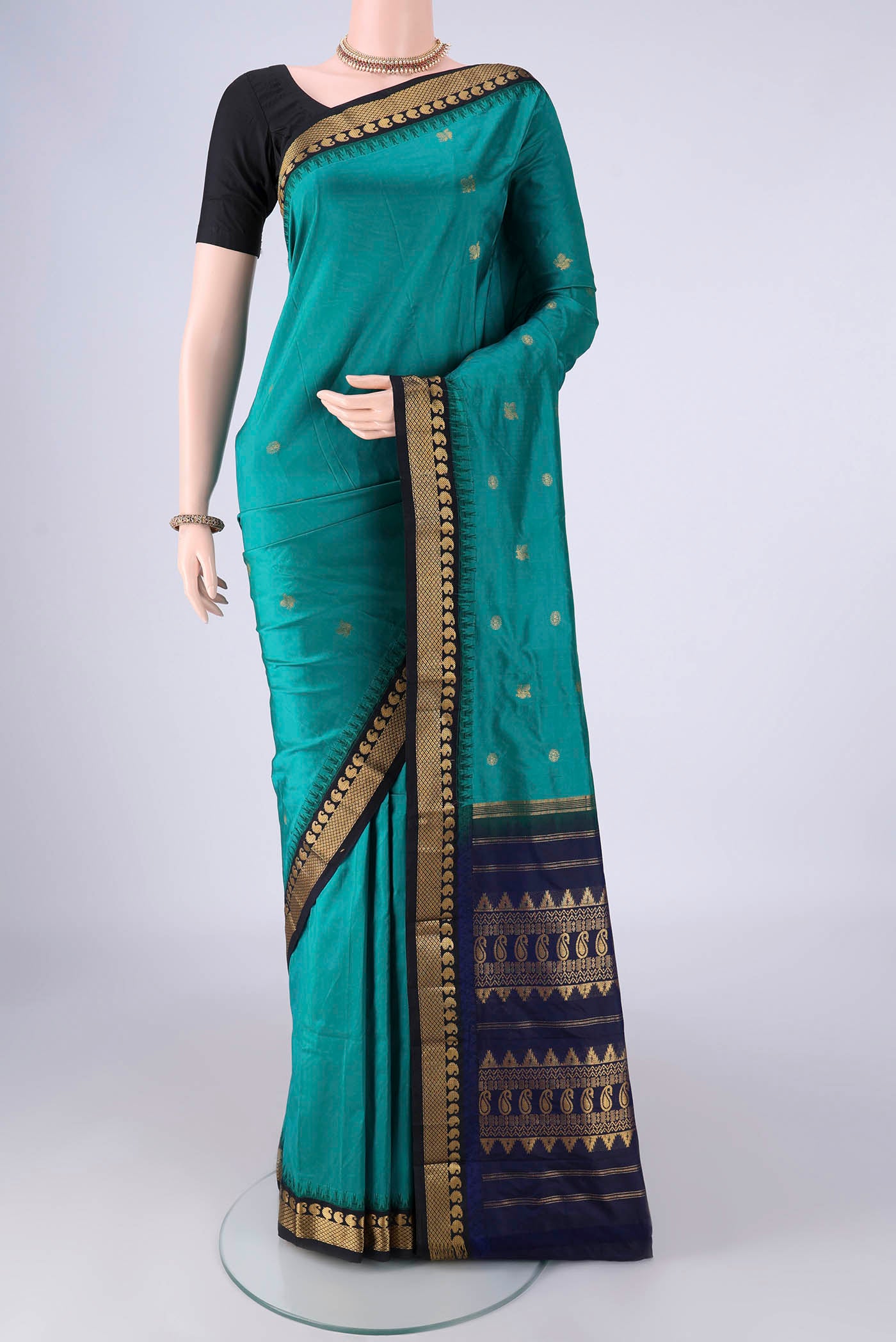 Sea Green Bangalore Silk - kadyal Saree with Zari Butta on the body and Zari Border.  displayed on a mannequin