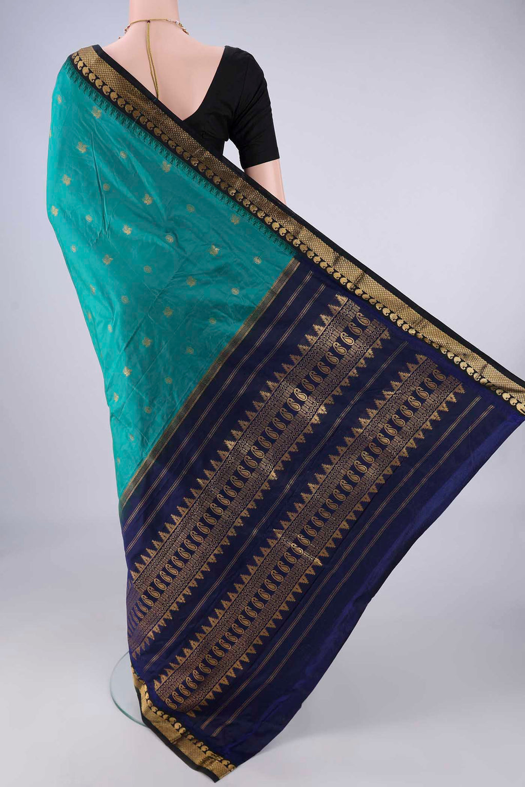 Flat view of Sea Green Bangalore Silk - kadyal Saree with Zari Butta on the body and Zari Border. 