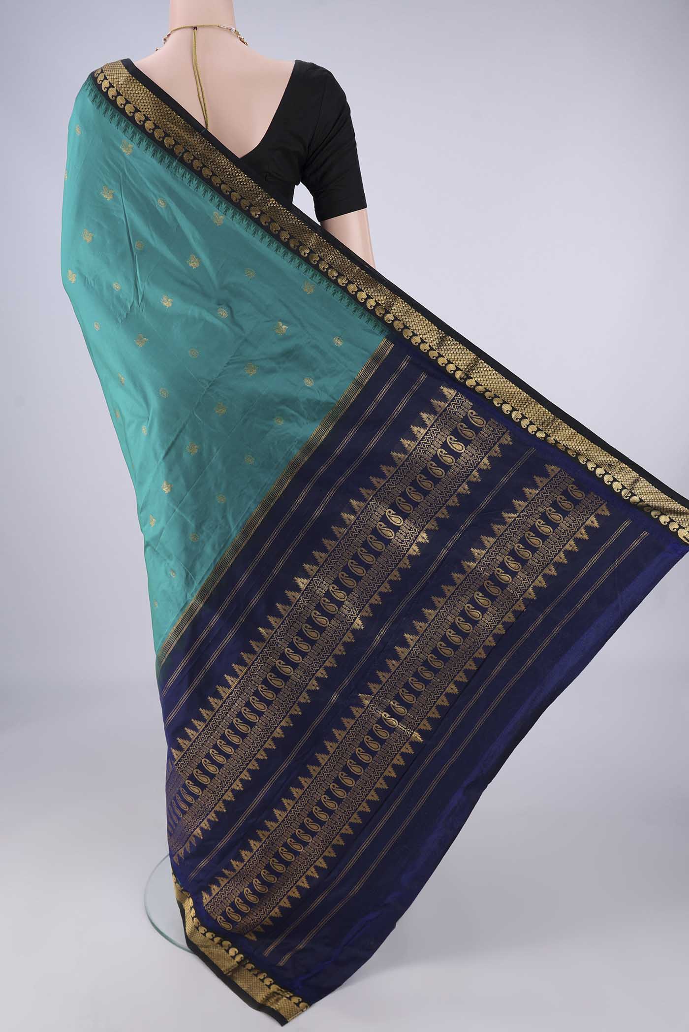 Flat view of Sea Green Bangalore Silk - kadyal Saree with Zari Butta on the body and Zari Border. 