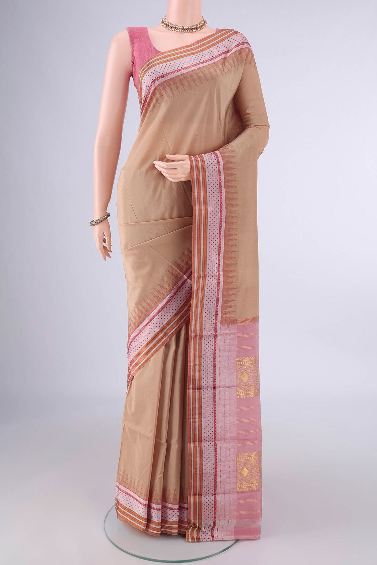 Pure Silk Beige Bangalore - kadyal Saree with Plain Body and Zari And Thread Border.  displayed on a mannequin