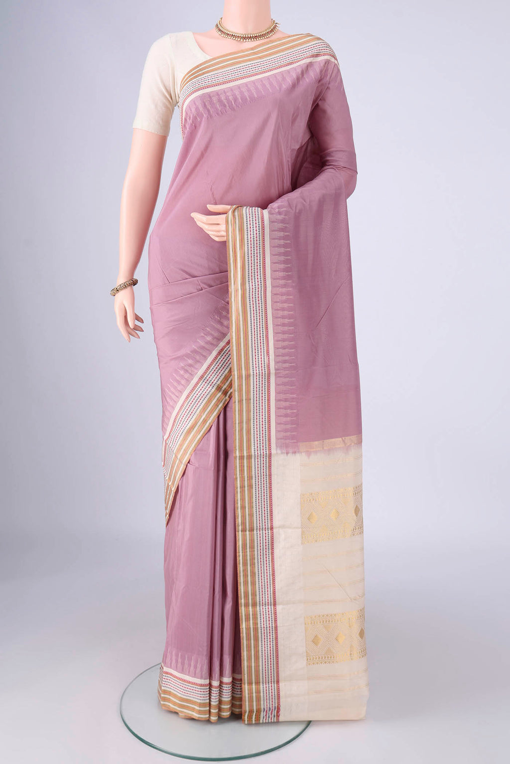 Lavender Bangalore Silk - kadyal Saree with Plain Body and Zari And Thread Border.  displayed on a mannequin