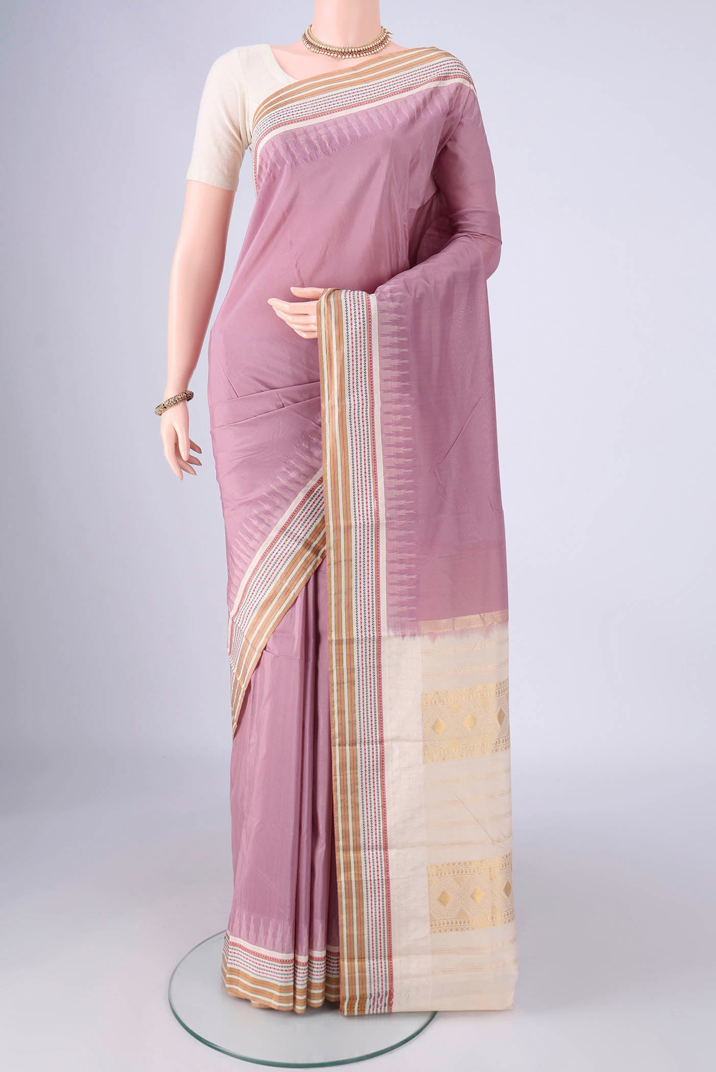Lavender Bangalore Silk - kadyal Saree with Plain Body and Zari And Thread Border.  displayed on a mannequin