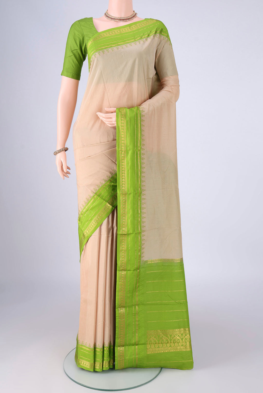 Beige Bangalore Silk - kadyal Saree with Plain Body and Temple Border.  displayed on a mannequin