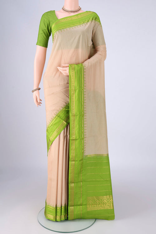 Beige Bangalore Silk - kadyal Saree with Plain Body and Temple Border.  displayed on a mannequin