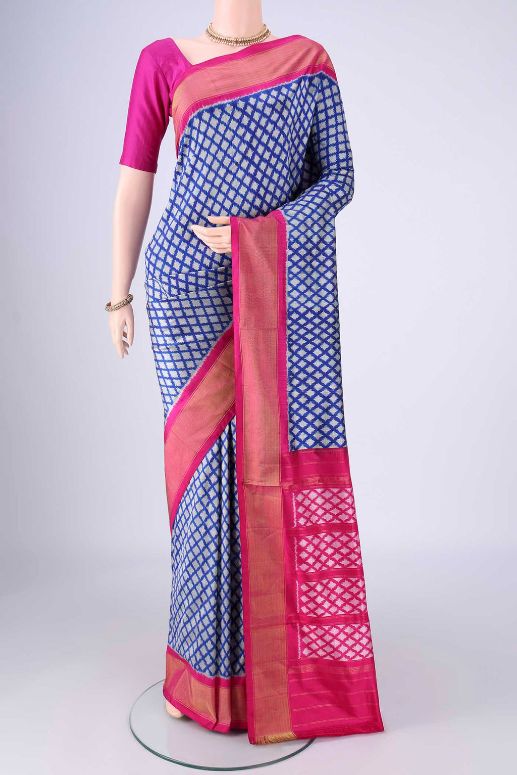 Blue Pochampally Silk Saree with Pure Ikat on the body and Zari Border.  displayed on a mannequin