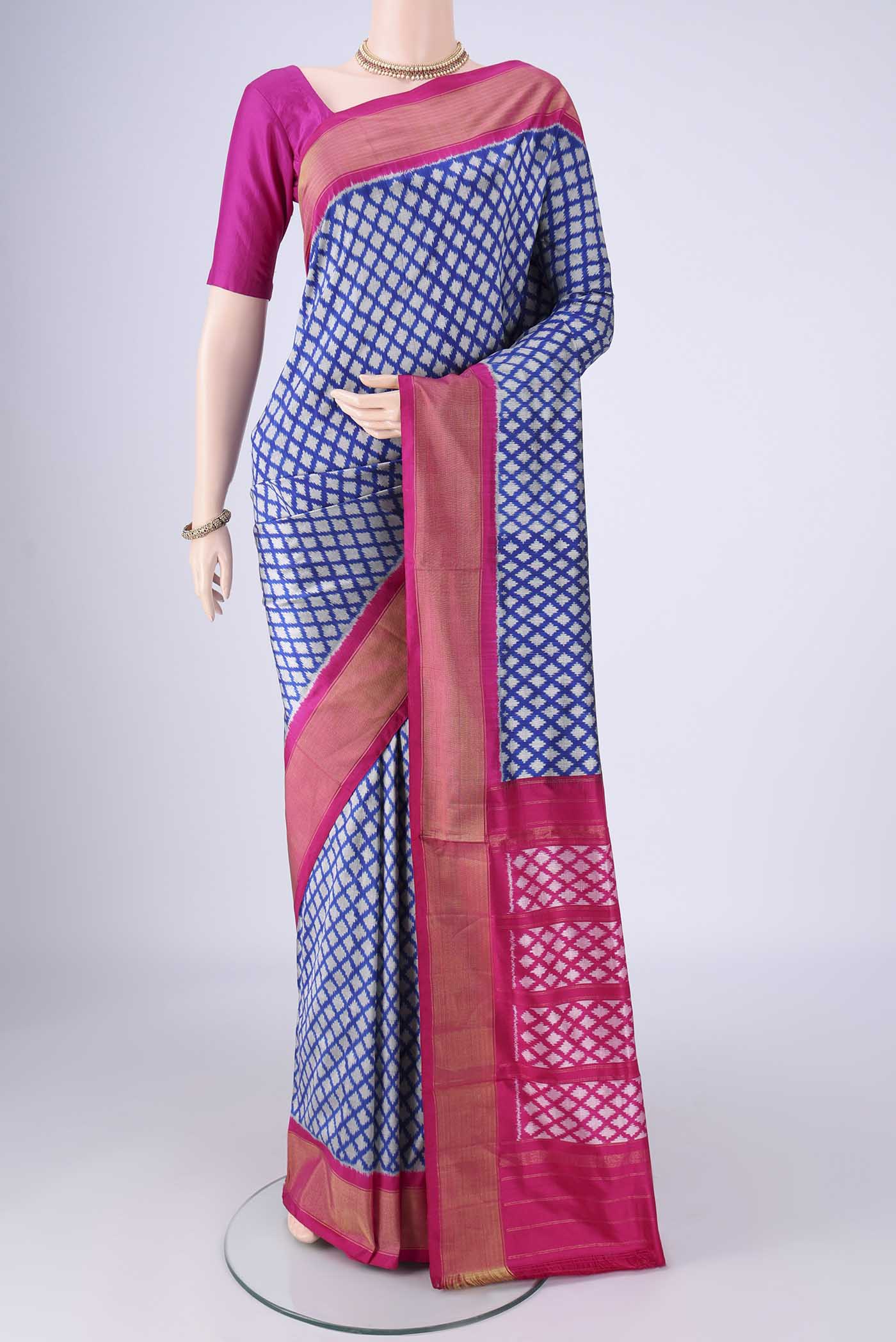 Blue Pochampally Silk Saree with Pure Ikat on the body and Zari Border.  displayed on a mannequin