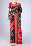 Black Pochampally Silk Saree with Pure Ikat on the body and Zari Border.  displayed on a mannequin
