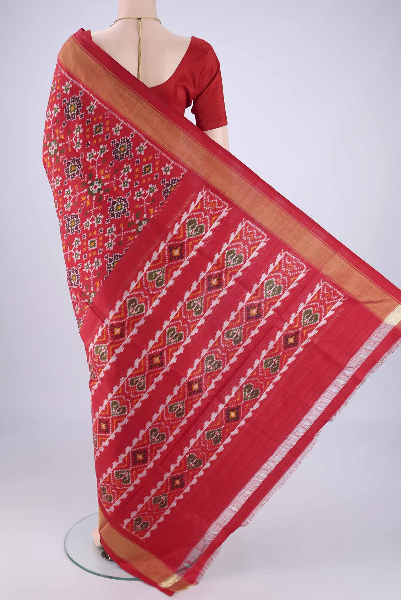 Flat view of Red Pochampally Silk Saree with Pure Ikat on the body and Zari Border. 