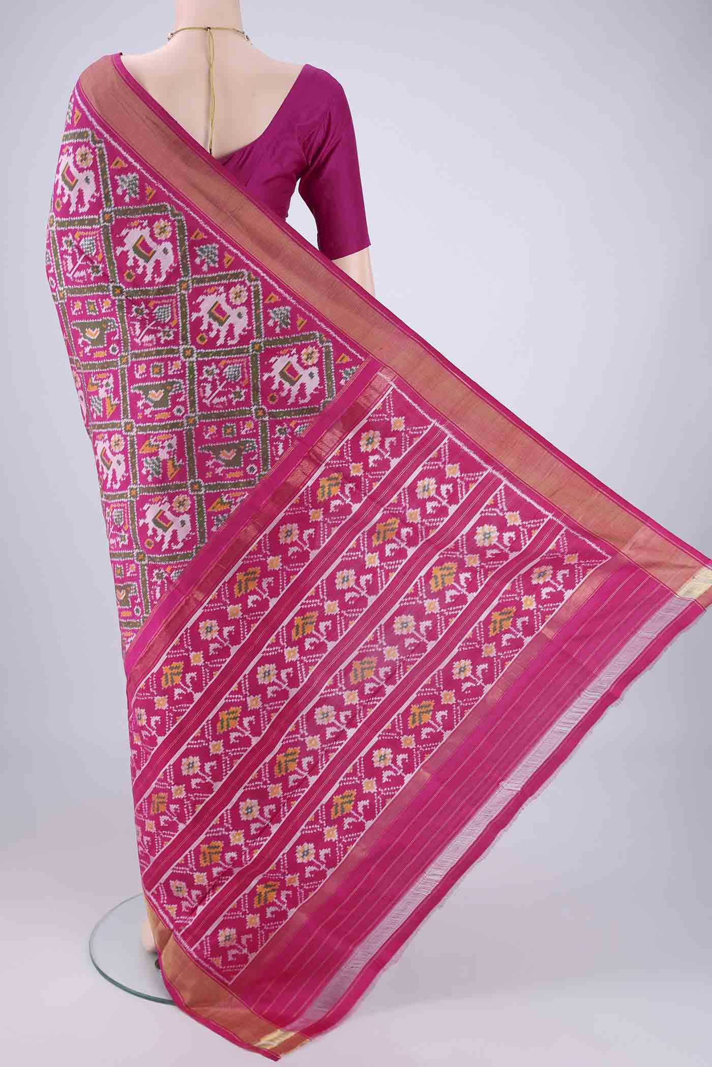 Flat view of Rani Pink Pochampally Silk Saree with Pure Ikat on the body and Zari Border. 