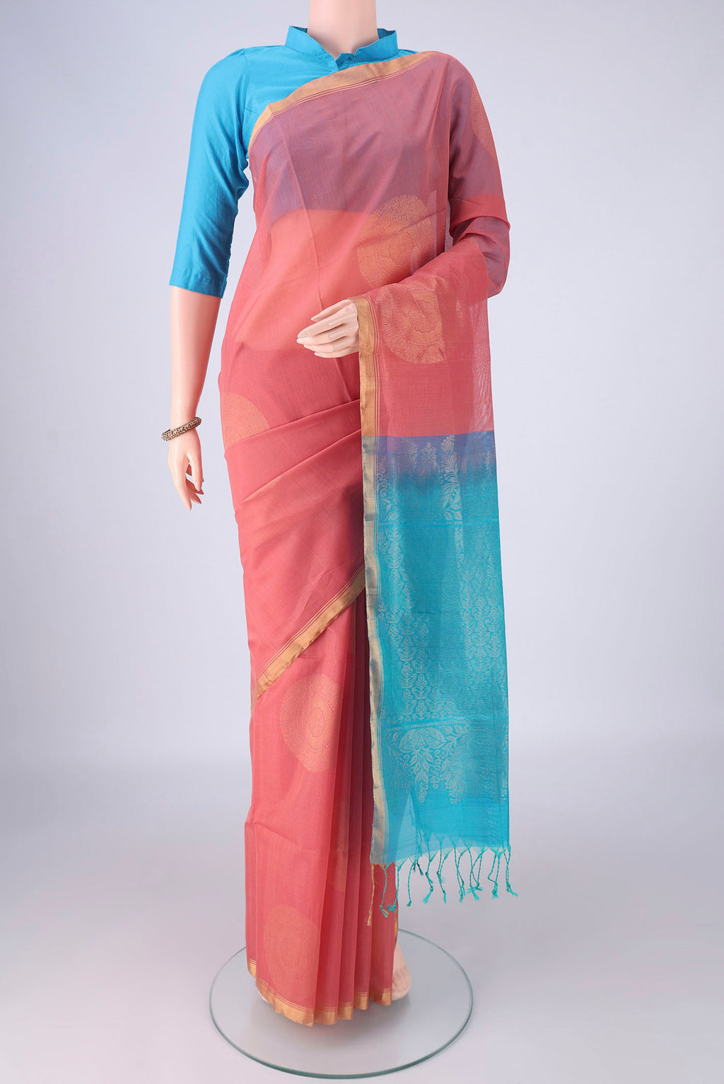 Rose pink Silk Cotton Saree with Zari Butta on the body and Zari Border.  displayed on a mannequin