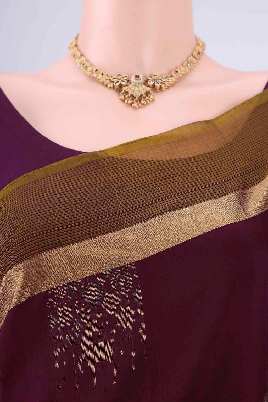 Border image of Burgundy Kora Cotton Saree with Zari Butta on the body and Zari Border. 