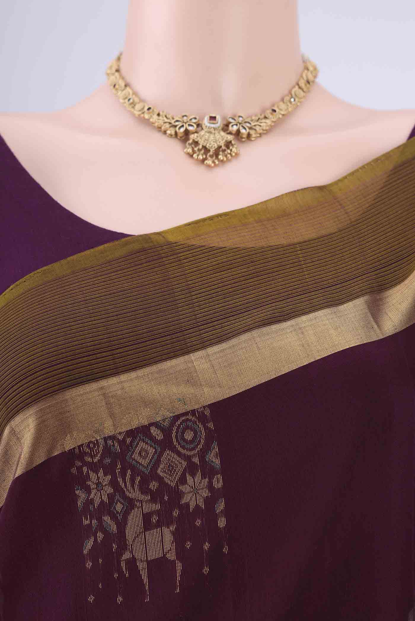 Border image of Burgundy Kora Cotton Saree with Zari Butta on the body and Zari Border. 