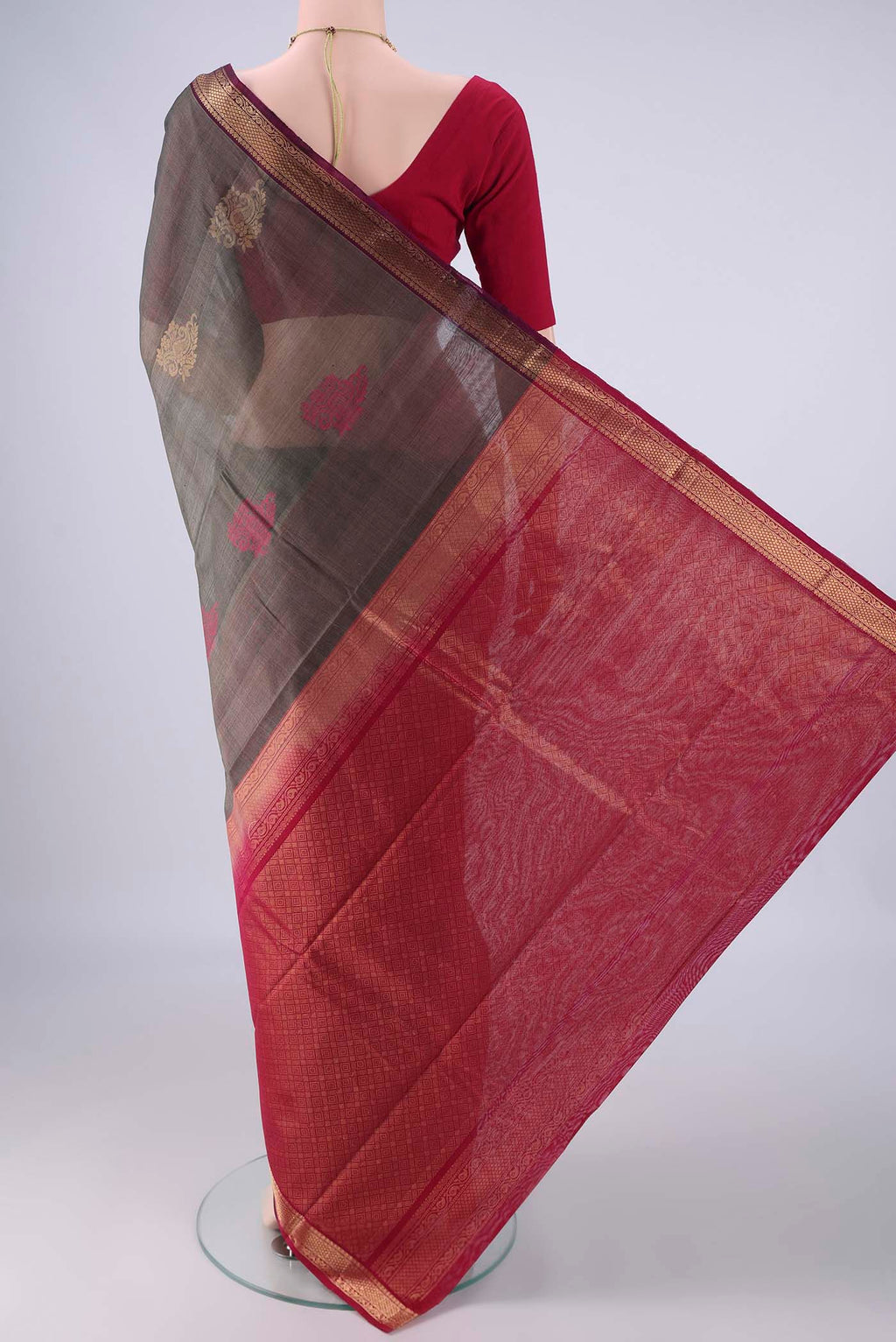 Flat view of Davys Grey Silk Cotton Saree with Zari Butta on the body and Zari Border. 