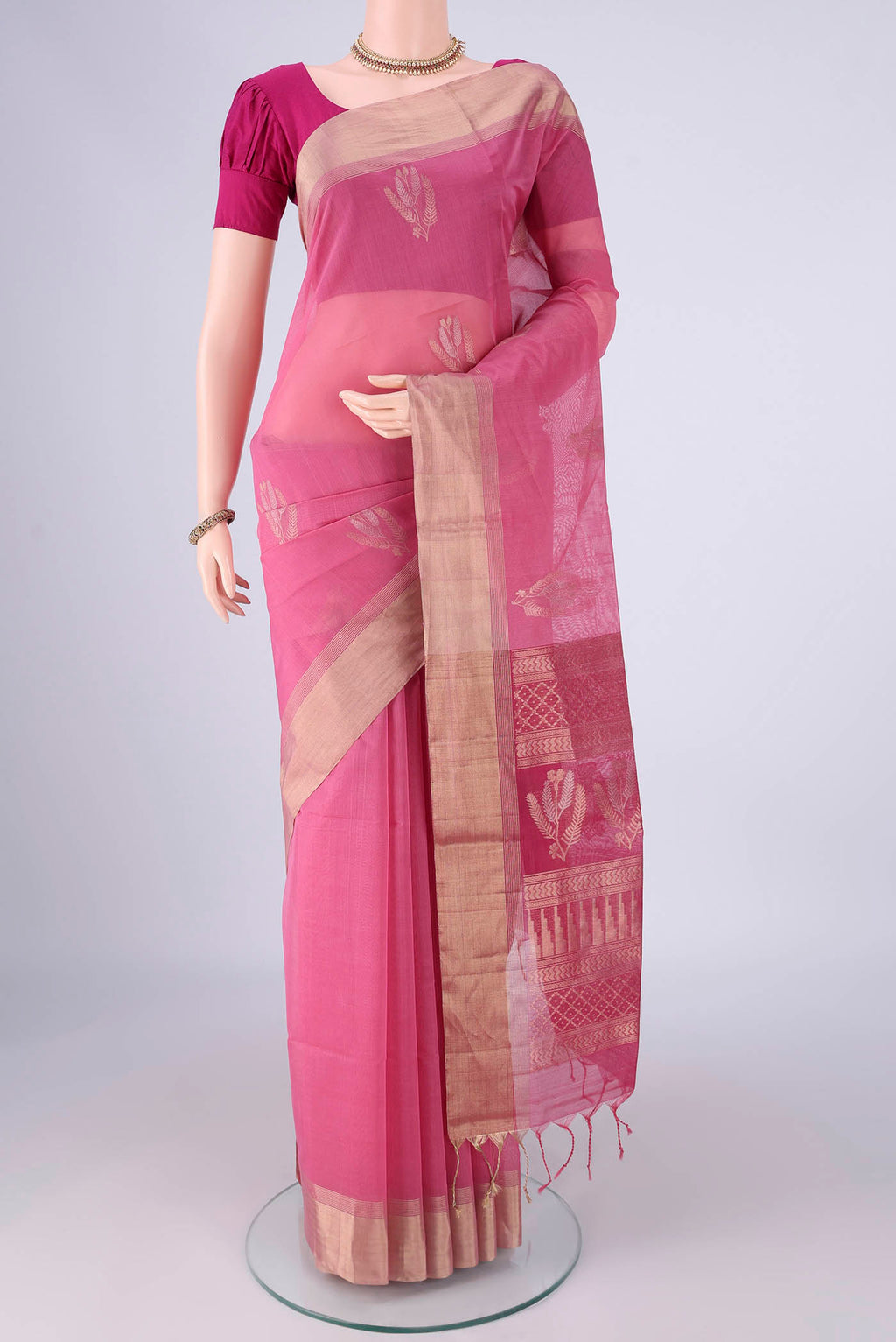Pink Silk Cotton Saree with Zari Butta on the body and Zari Border.  displayed on a mannequin