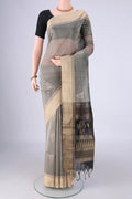 Grey Silk Cotton Saree with Zari Butta on the body and Zari Border.  displayed on a mannequin