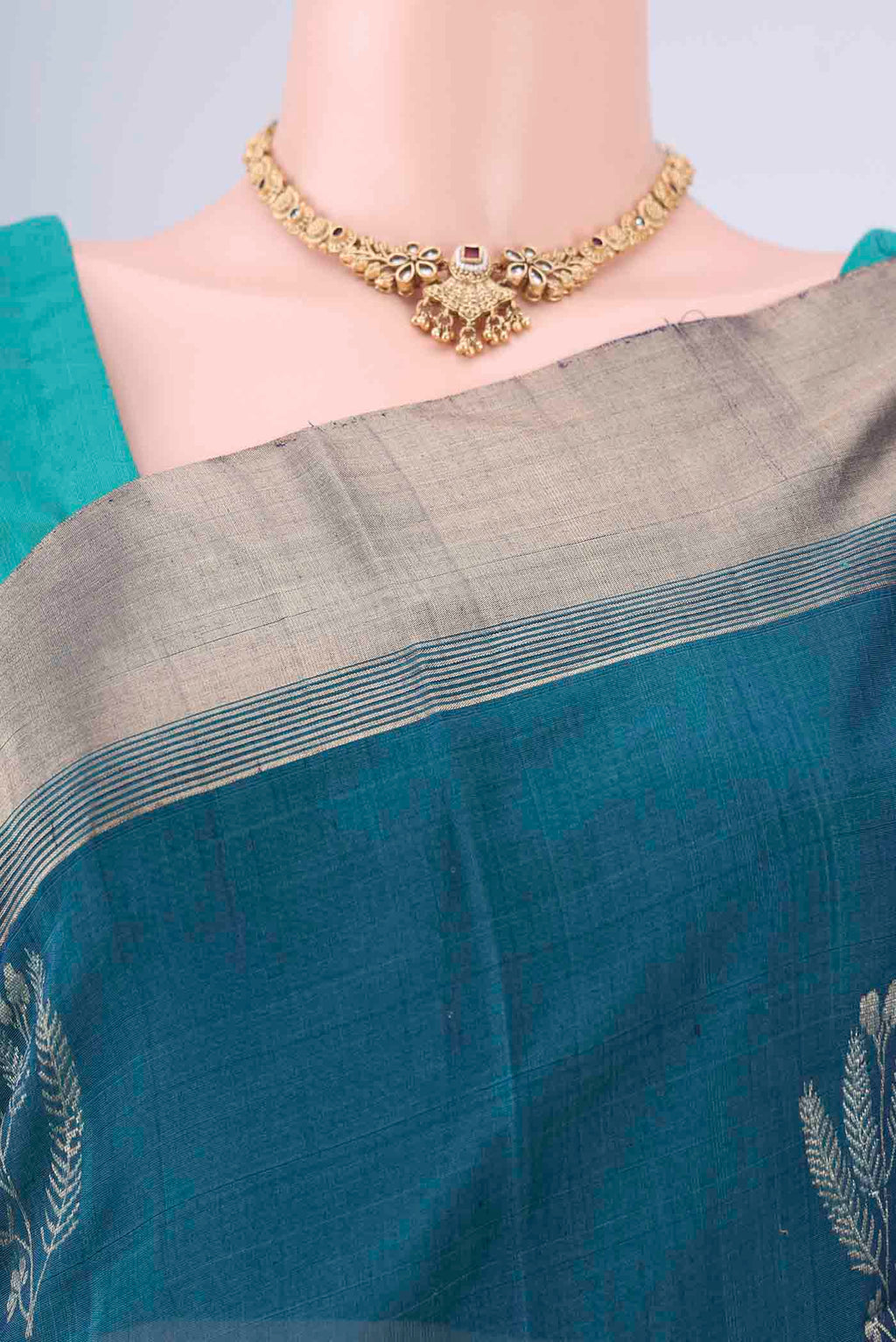 Border image of Peacock Blue Kora Cotton Saree with Zari Butta on the body and Zari Border. 