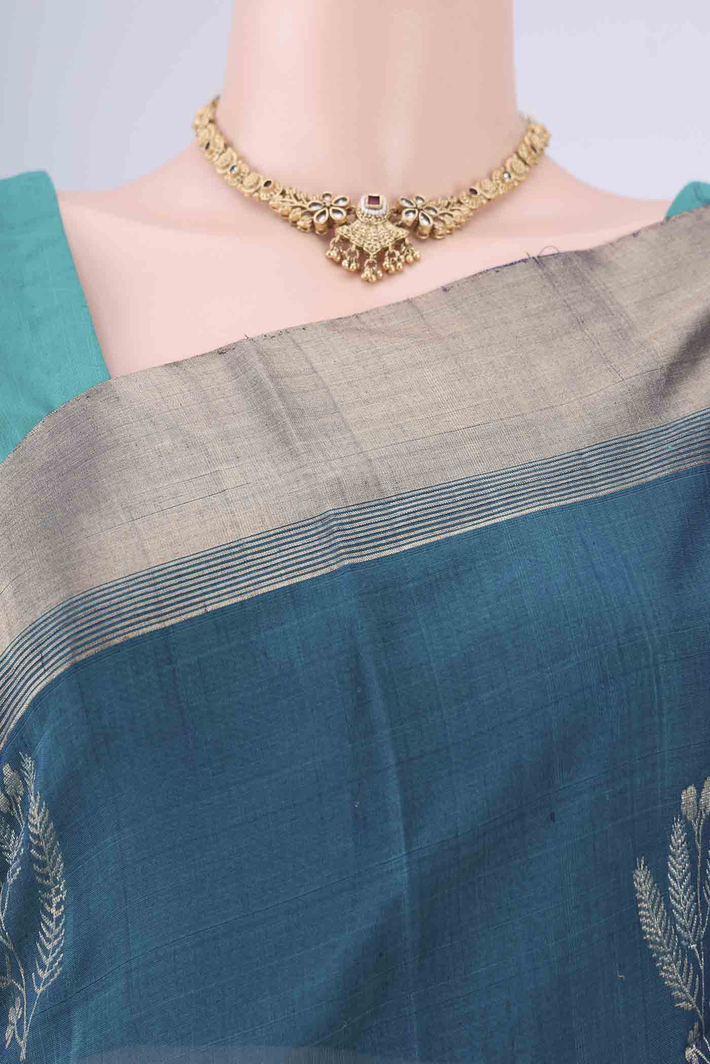 Border image of Peacock Blue Kora Cotton Saree with Zari Butta on the body and Zari Border. 