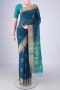 Peacock Blue Kora Cotton Saree with Zari Butta on the body and Zari Border.  displayed on a mannequin