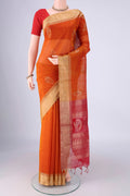 Brick Orange Silk Cotton Saree with Zari Butta on the body and Zari Border.  displayed on a mannequin