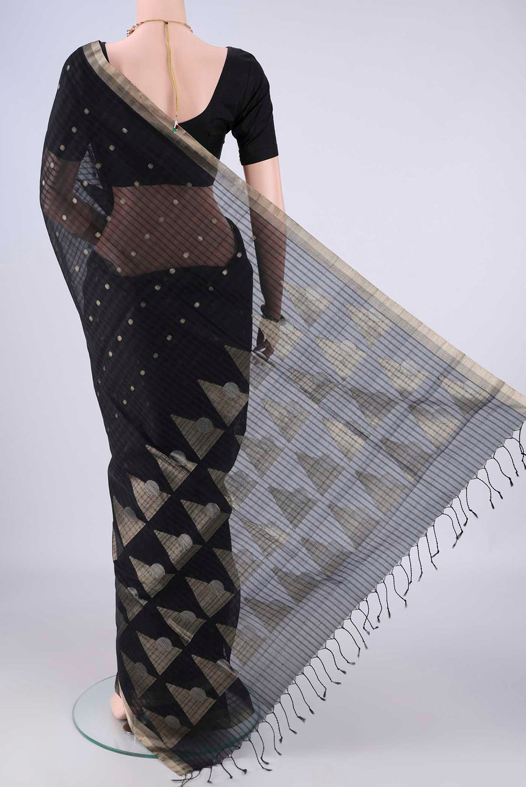 Flat view of Black Silk Cotton Saree with Zari Butta on the body and Zari Border. 