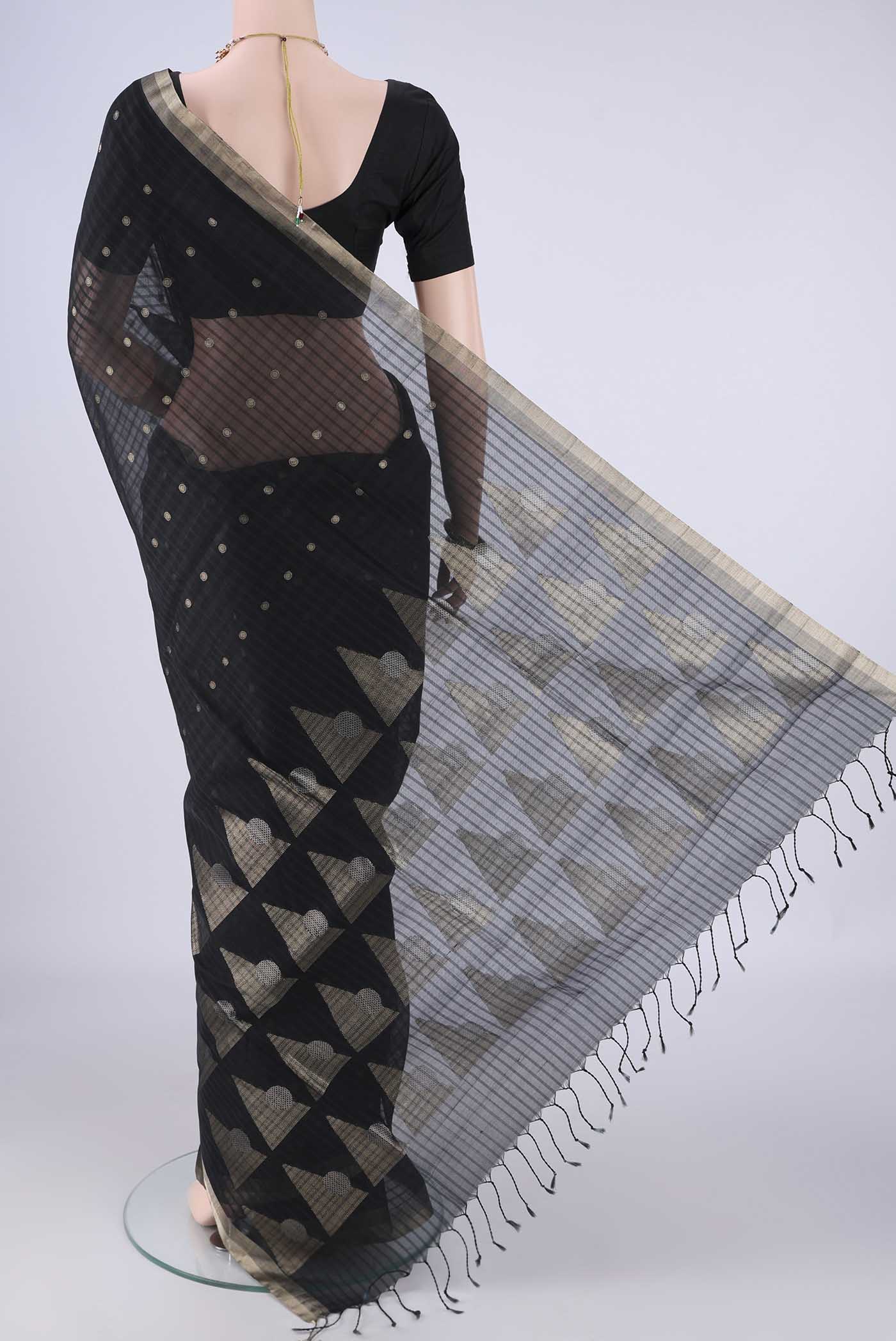 Flat view of Black Silk Cotton Saree with Zari Butta on the body and Zari Border. 