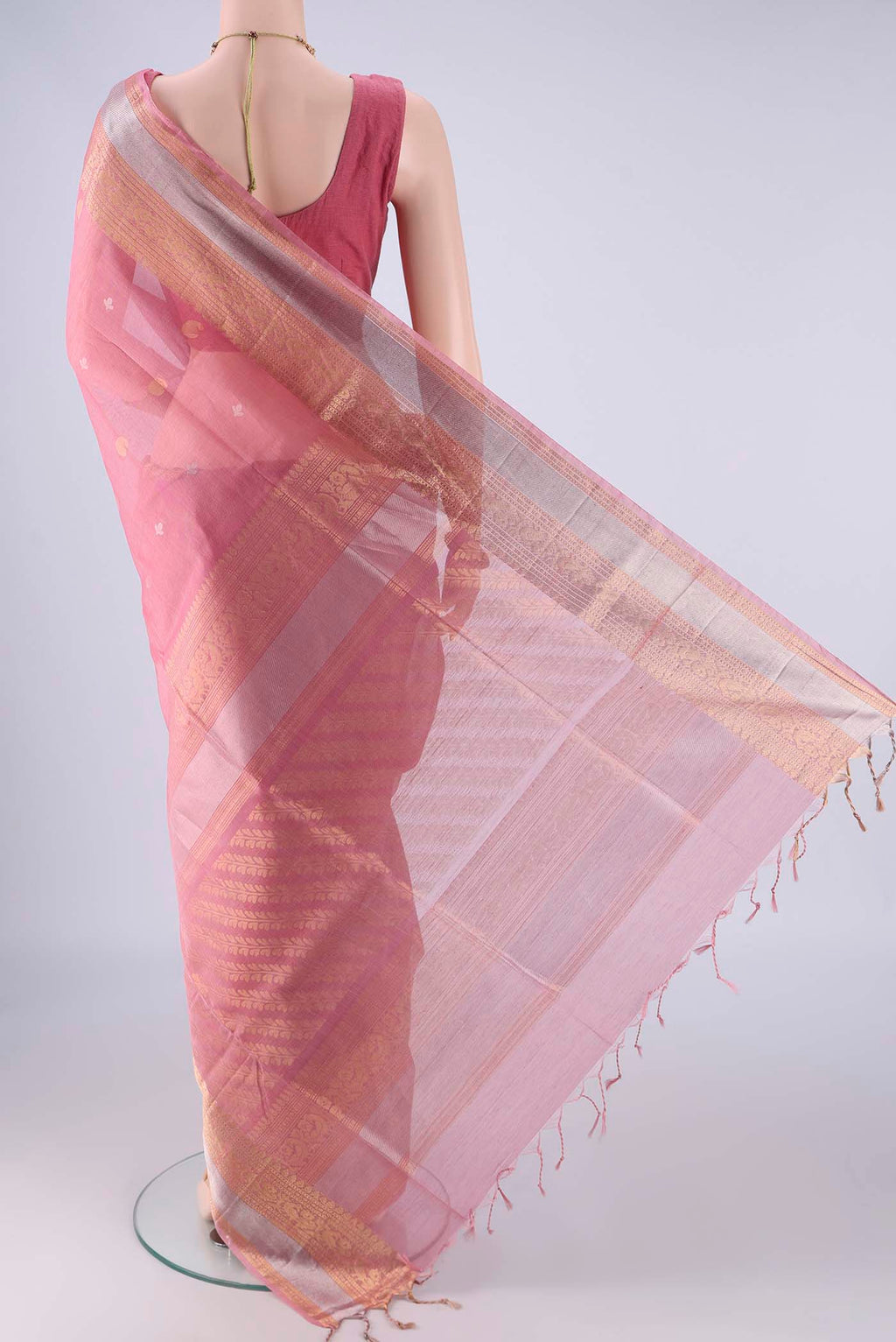 Flat view of Rose pink Silk Cotton Saree with Zari Butta on the body and Zari Border. 