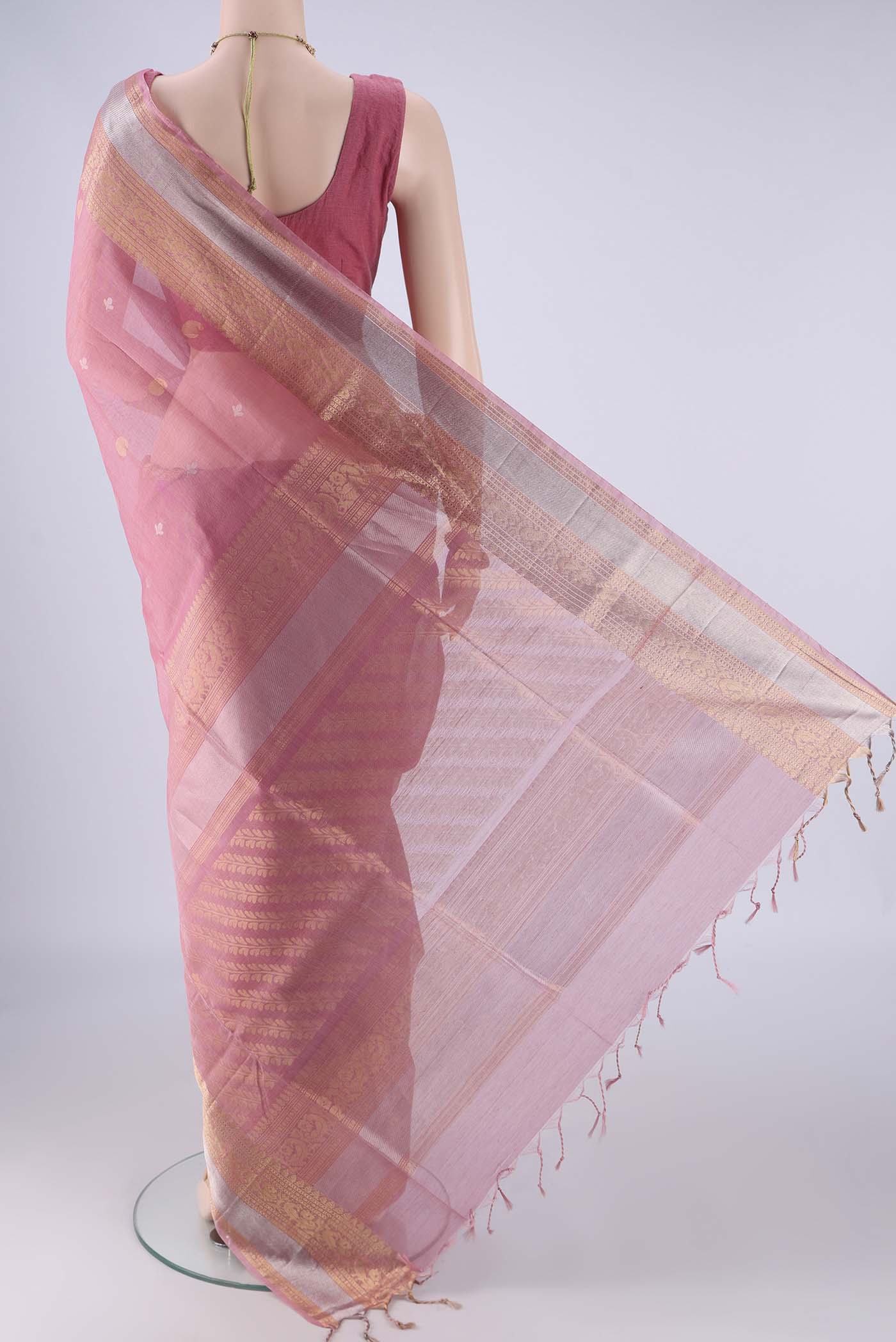 Flat view of Rose pink Silk Cotton Saree with Zari Butta on the body and Zari Border. 