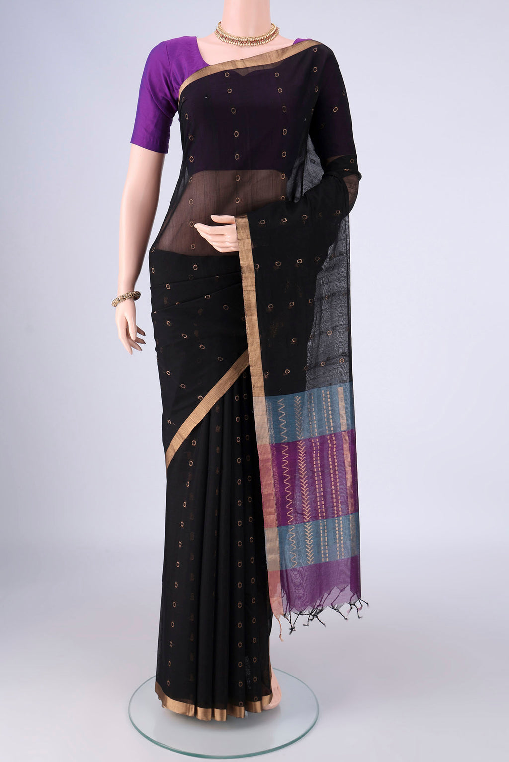 Black Silk Cotton Saree with Zari And Thread Butta on the body and Zari Border.  displayed on a mannequin